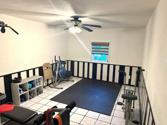 a bedroom with a bed and a view of bathroom