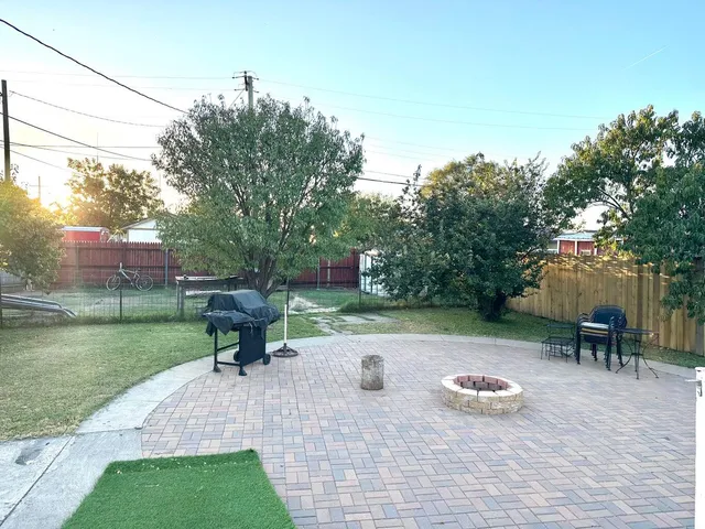 a view of swimming pool with outdoor seating and plants