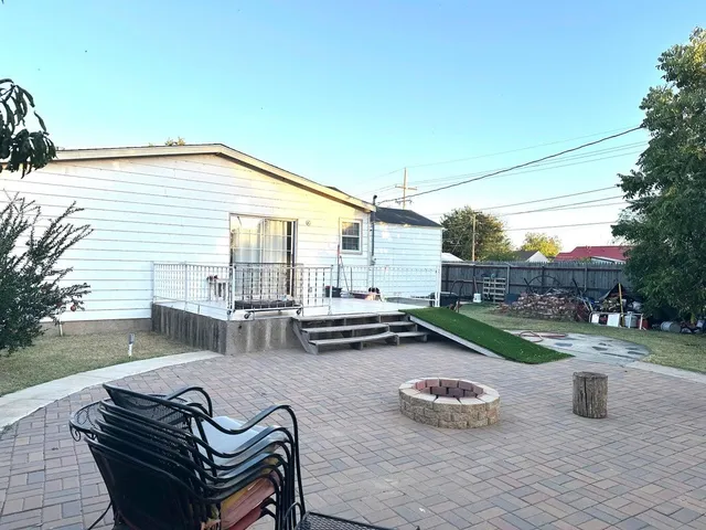 a front view of a house with a garden and yard