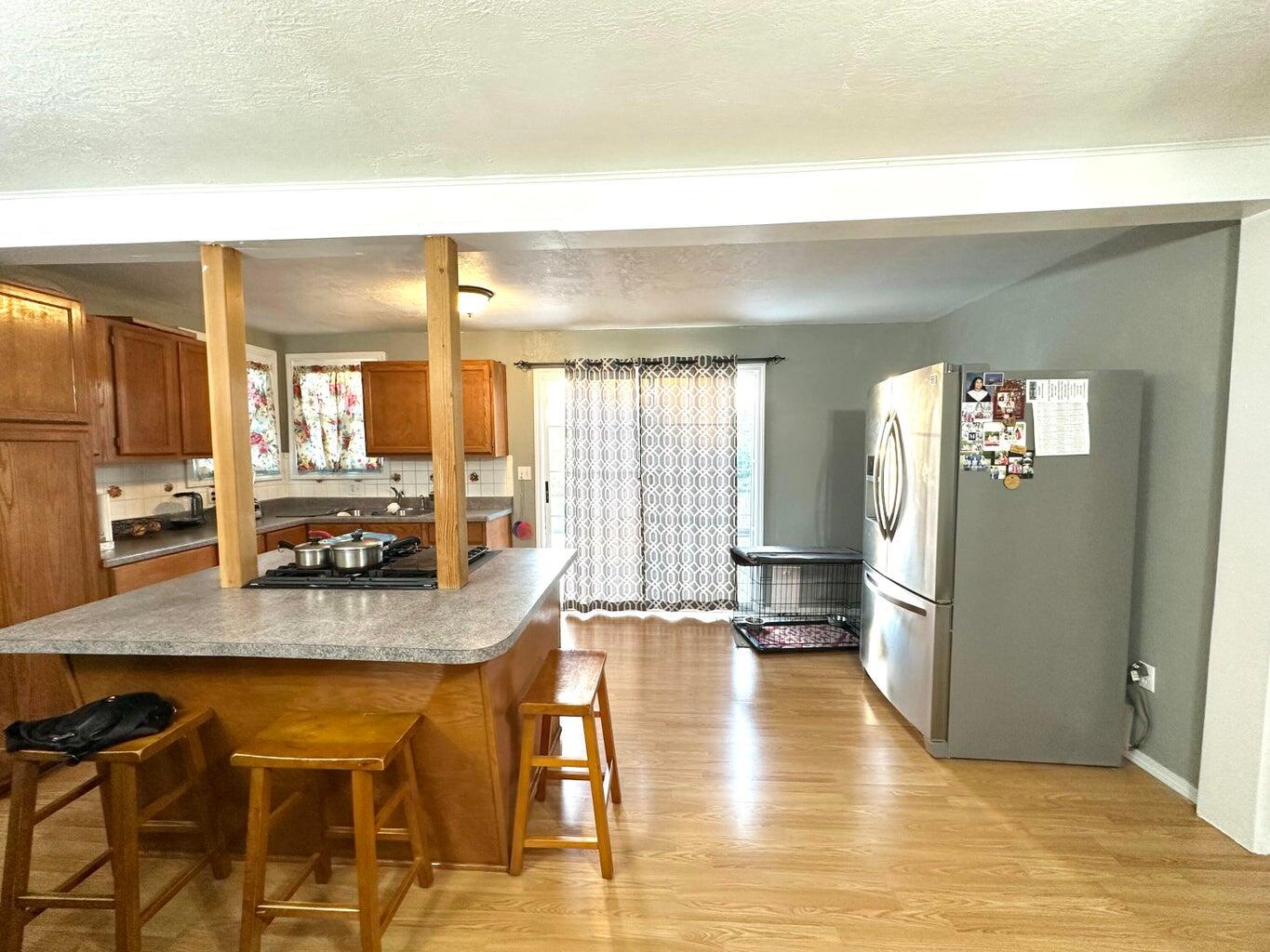 401 Xenia Street Plainview, TX 79072 - Photo 5 of 20 a kitchen with stainless steel appliances granite countertop a granite counter tops and a view of living room