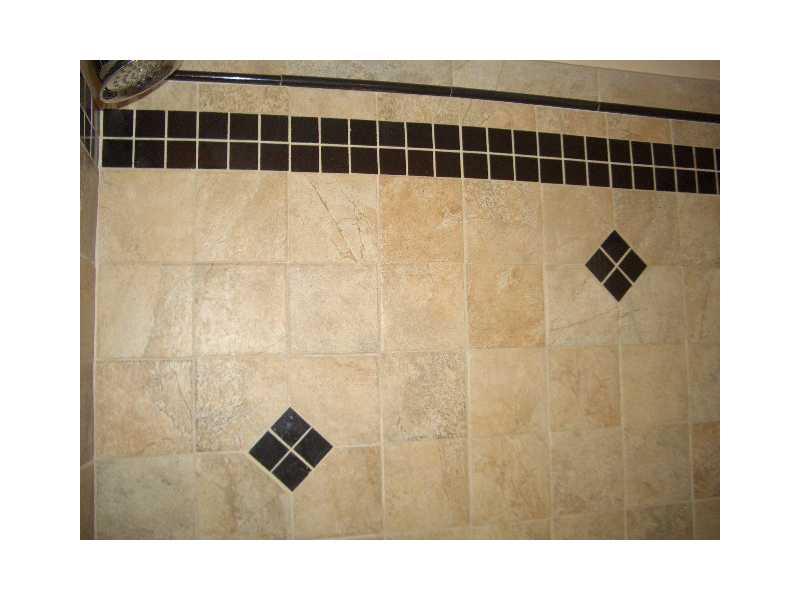 228 Orchard Spring Road Pittsburgh, PA 15220 - Photo 11 of 21 Full Bath. THE TILED SHOWER WITH NOOK IS PICKED OUT WITH BLACK GRANITE FEATURES.