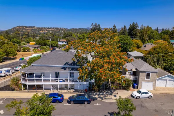 a aerial view of a house with a garden and a yard
