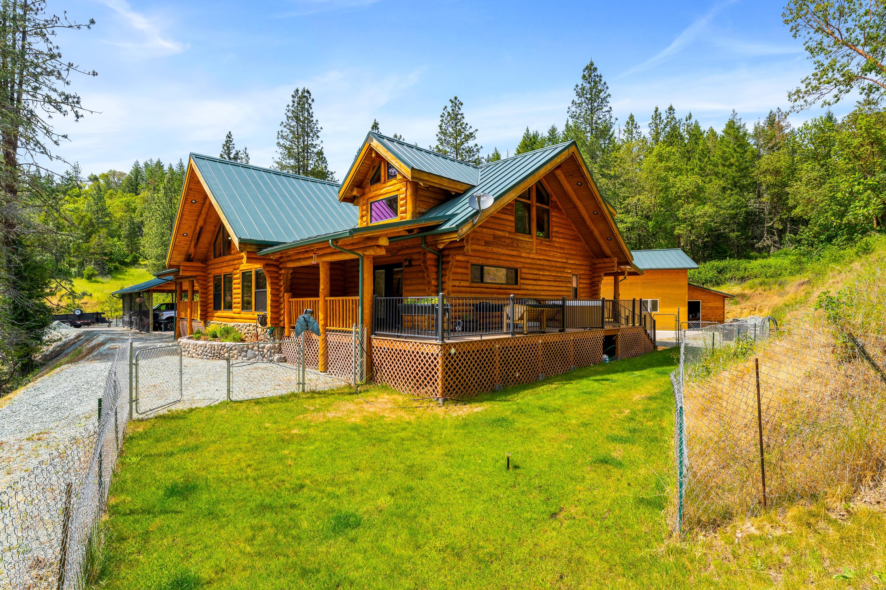 225 Eagle Ridge Road Canyonville, OR 97417 - Photo 21 of 52 a view of house with yard and sitting area