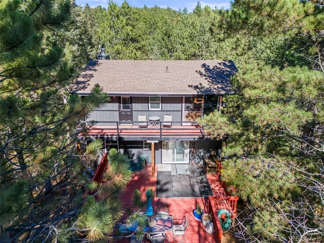 a dining room with furniture a rug and wooden floor