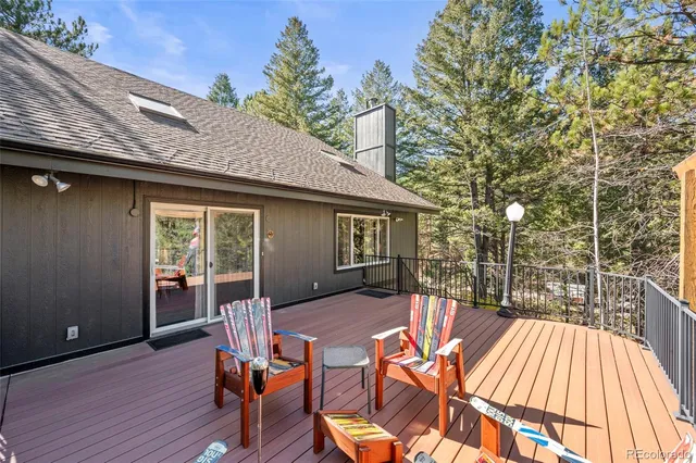 a living room with fireplace furniture and a wooden floor