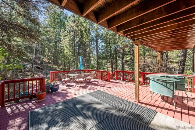 a bedroom with a bed and large window