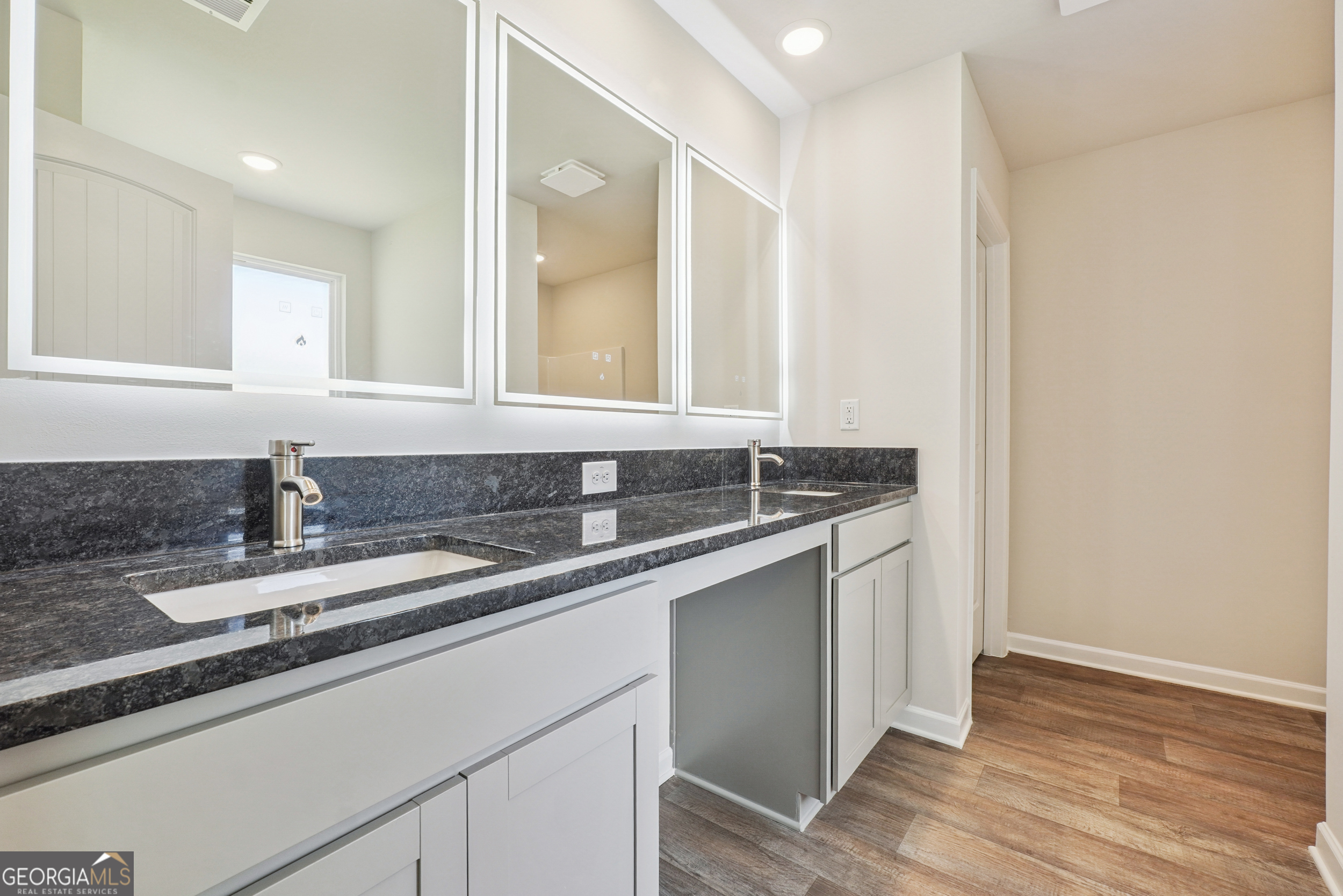 210 Harris Walk, Unit 79 Cataula, GA 31804 - Photo 12 of 22 a bathroom with a sink and a mirror