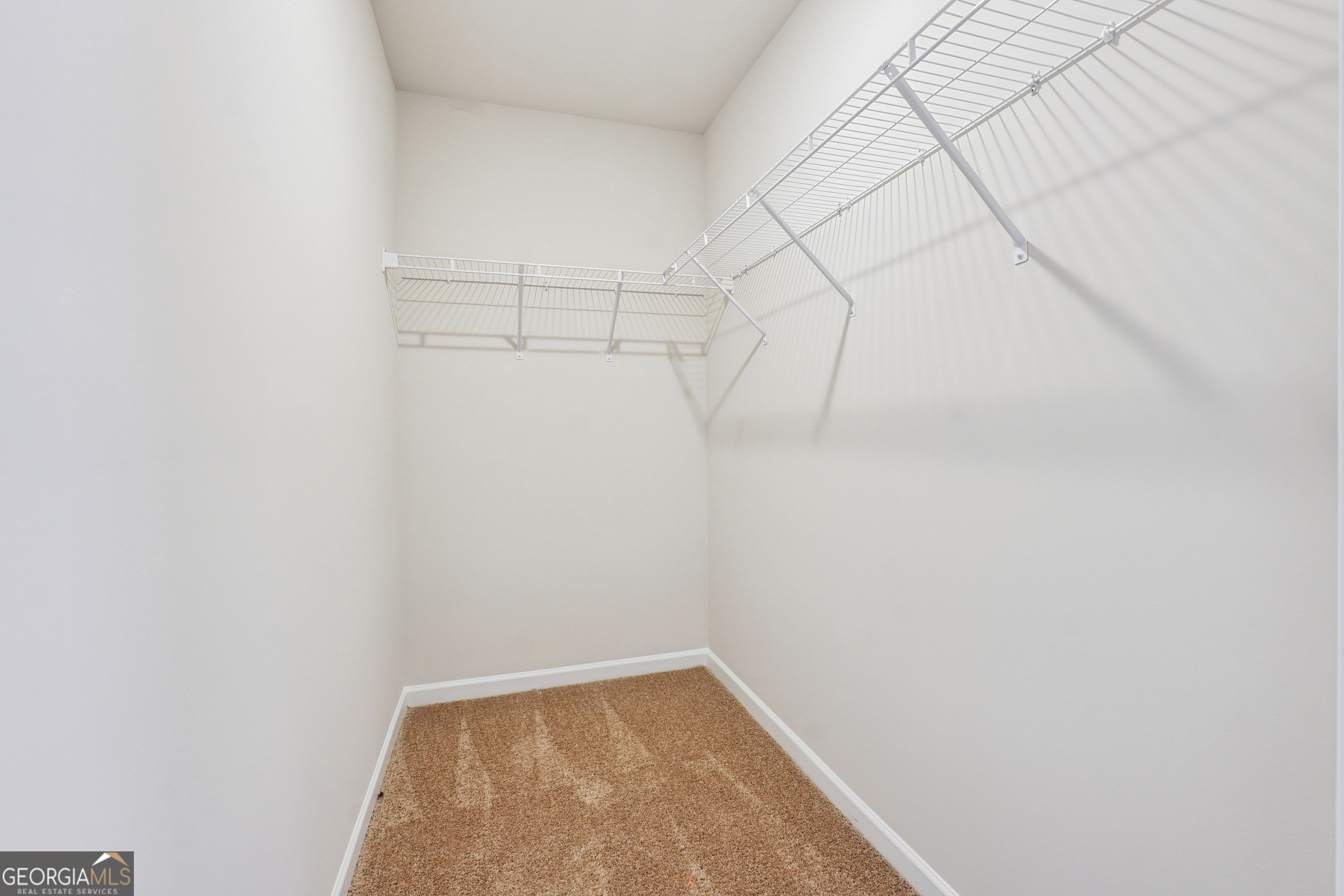 210 Harris Walk, Unit 79 Cataula, GA 31804 - Photo 16 of 22 a view of a room with racks on the wall