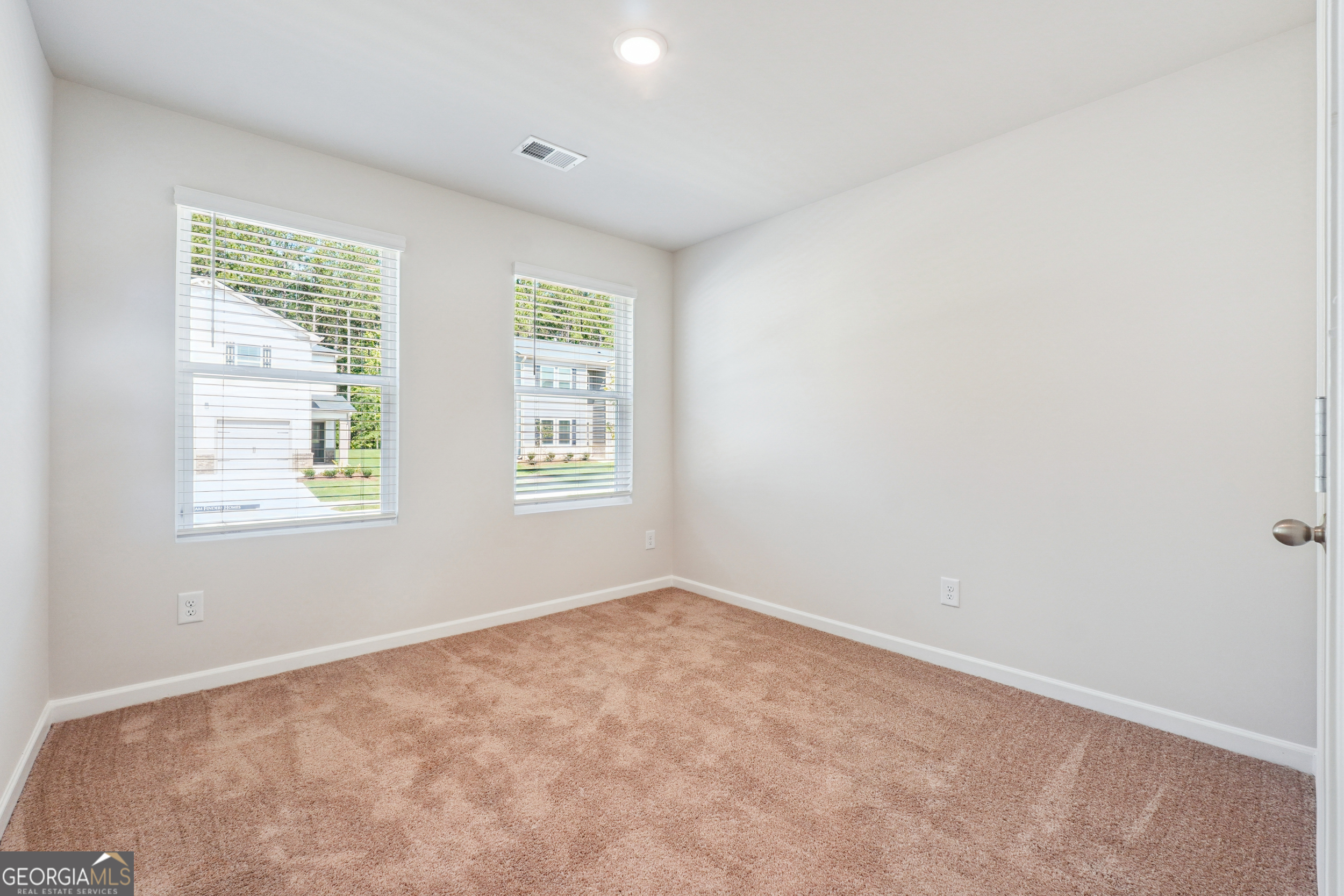 210 Harris Walk, Unit 79 Cataula, GA 31804 - Photo 19 of 22 an empty room with windows
