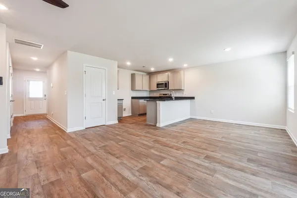 a view of a kitchen with a sink and a microwave