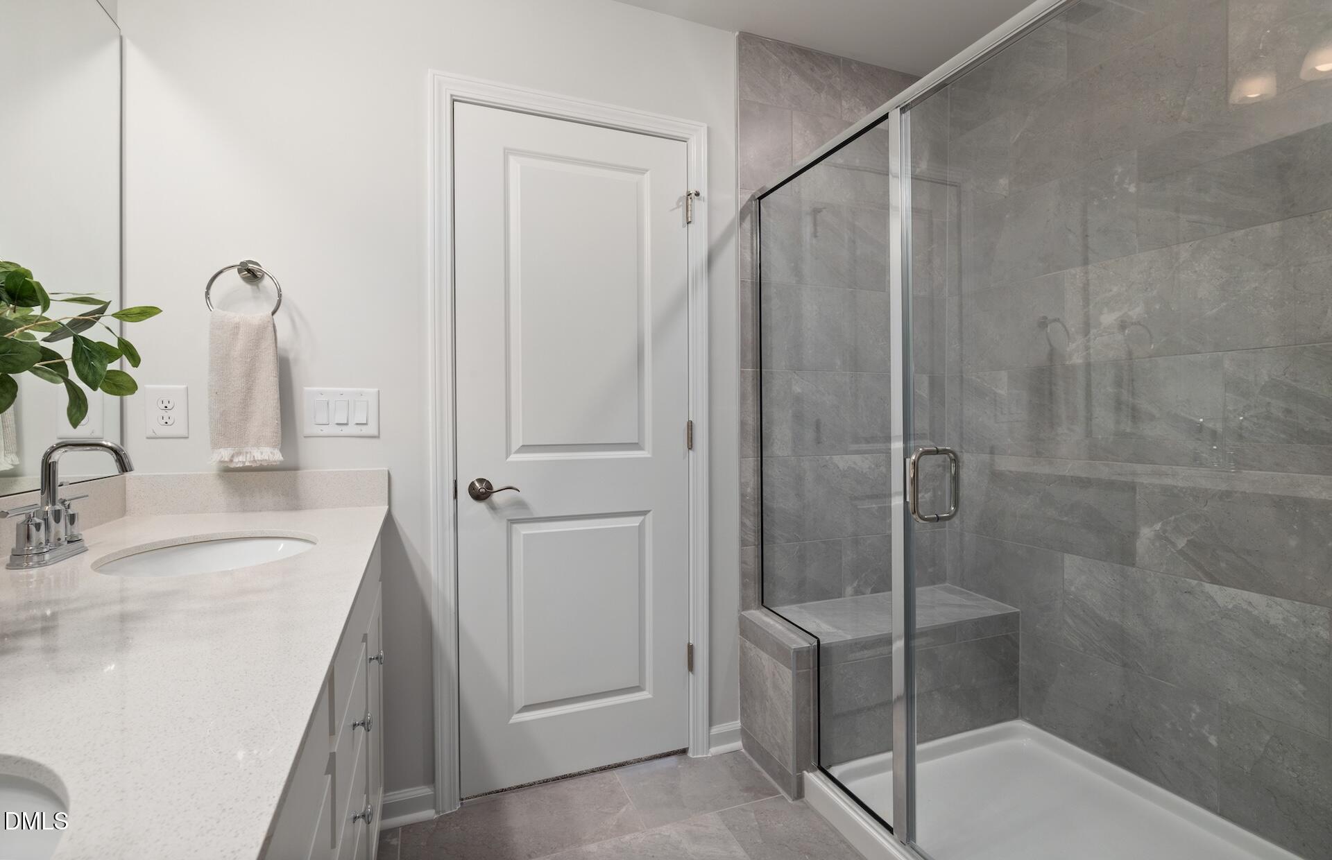 2814 Rodeo Court Fuquay-Varina, NC 27526 - Photo 17 of 31 a bathroom with a granite countertop sink mirror and shower