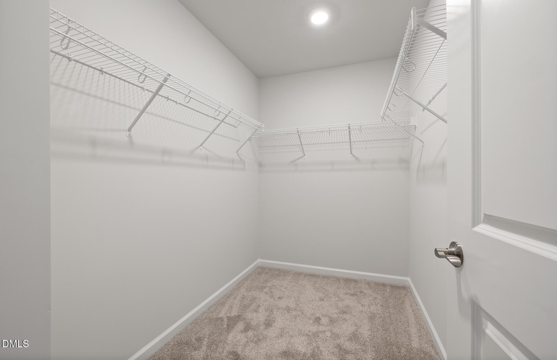 2814 Rodeo Court Fuquay-Varina, NC 27526 - Photo 19 of 31 a view of a room with racks on the wall