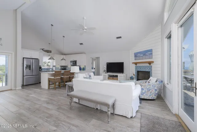 a kitchen with granite countertop white cabinets and stainless steel appliances