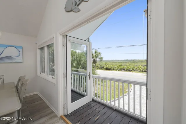 a bedroom with a bed wooden floor and furniture