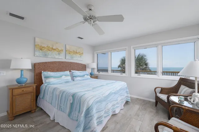 a bedroom with a large bed and a couch