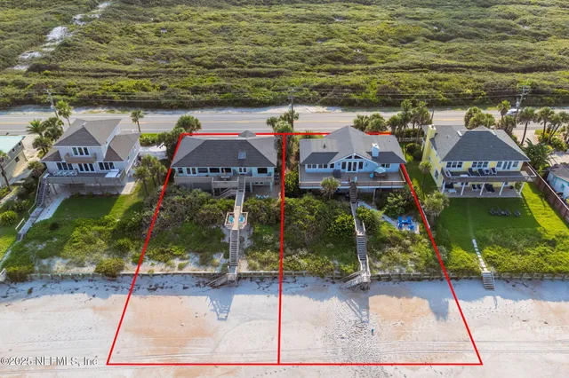 a front view of house with yard and trees around