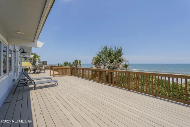 a view of a balcony with furniture