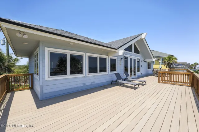 a view of a balcony dining area with furniture