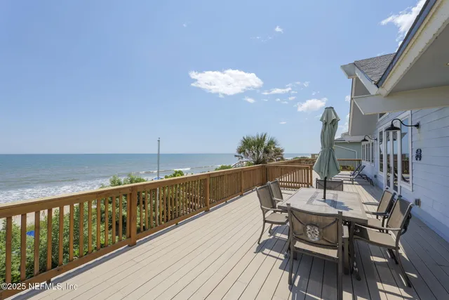 a view of balcony with wooden floor