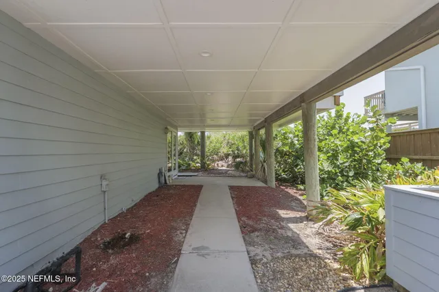 a view of a hallway with a outdoor space