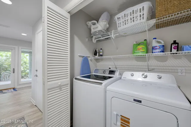 a view of an entryway with wooden floor and stairs