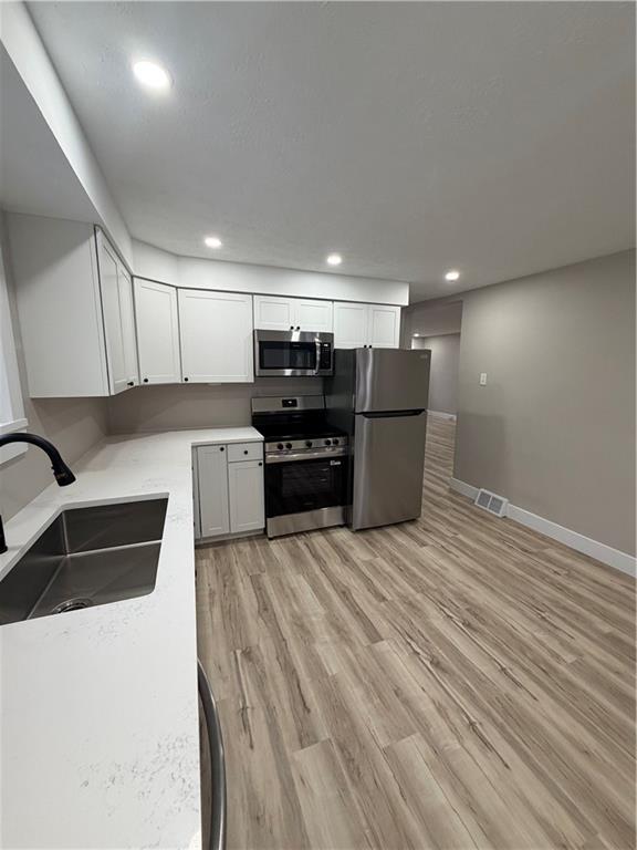 8 Ziskind Road Fredericktown, PA 15333 - Photo 11 of 31 a kitchen with stainless steel appliances kitchen island granite countertop a refrigerator and a stove top oven