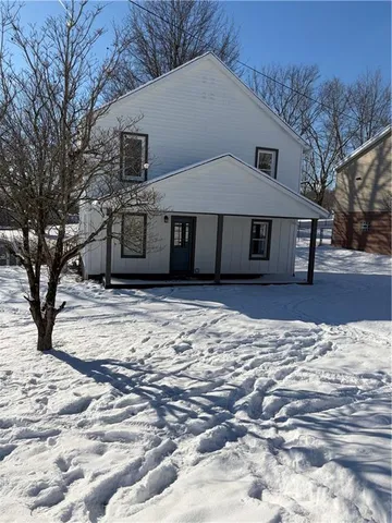 a house with trees in front of it