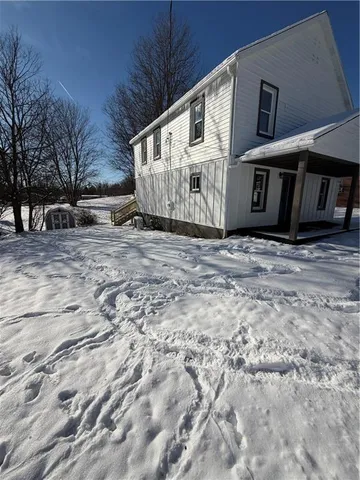 a view of a house with a snow