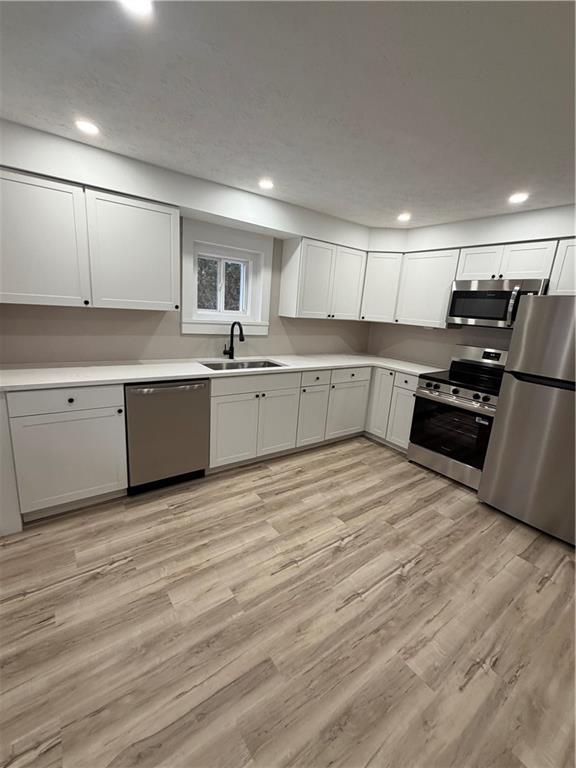 8 Ziskind Road Fredericktown, PA 15333 - Photo 10 of 31 a kitchen with stainless steel appliances granite countertop a stove and a sink
