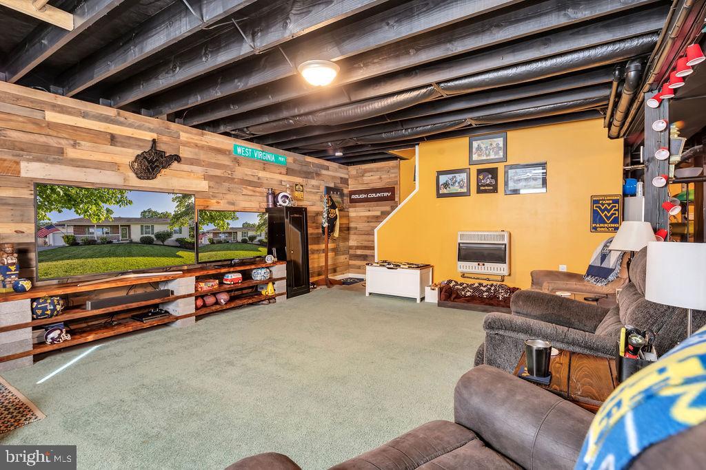 138 Woodrow Road Winchester, VA 22602 - Photo 23 of 30 Basement Rec Room with customized wood accent wall