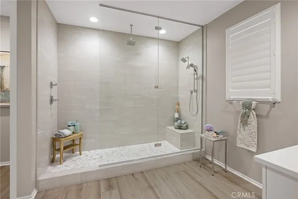 a bathroom with a tub a sink and a shower