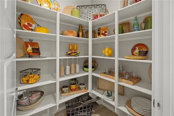 a room with a wooden floor and shoes