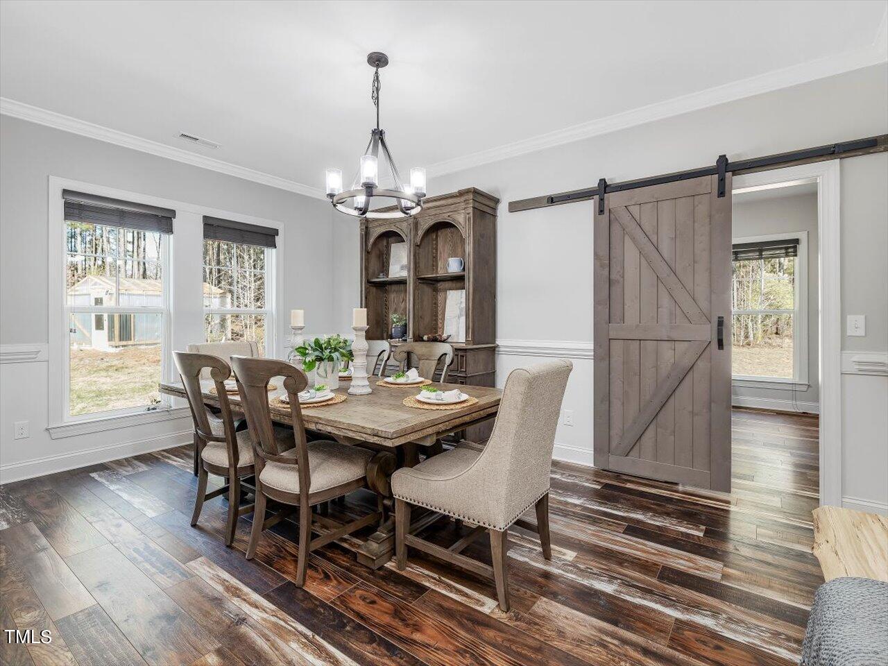 406 Gum Springs Church Road Moncure, NC 27559 - Photo 14 of 100 a view of a dining room with furniture window and wooden floor
