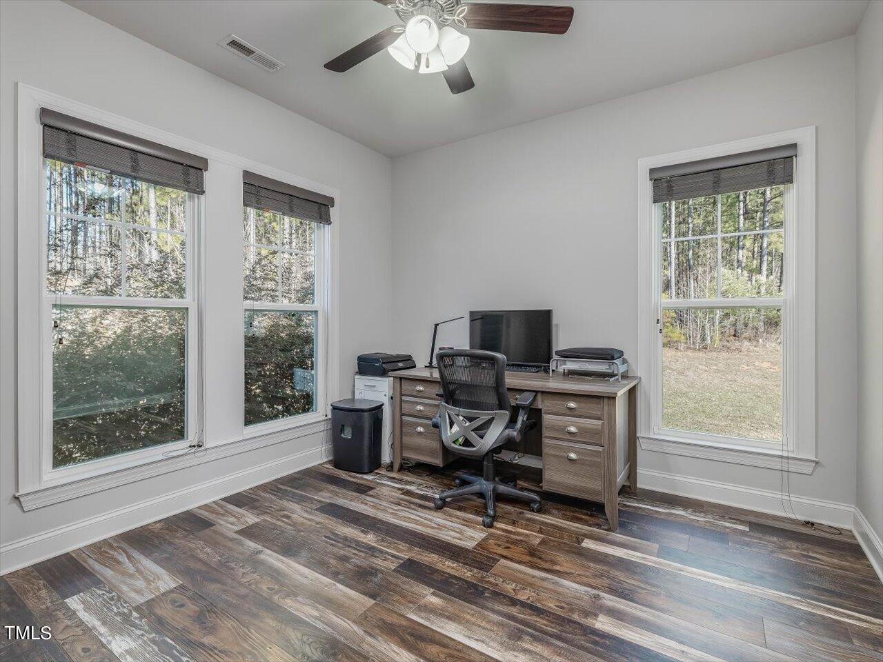 406 Gum Springs Church Road Moncure, NC 27559 - Photo 16 of 100 a view of a workspace with furniture and a window