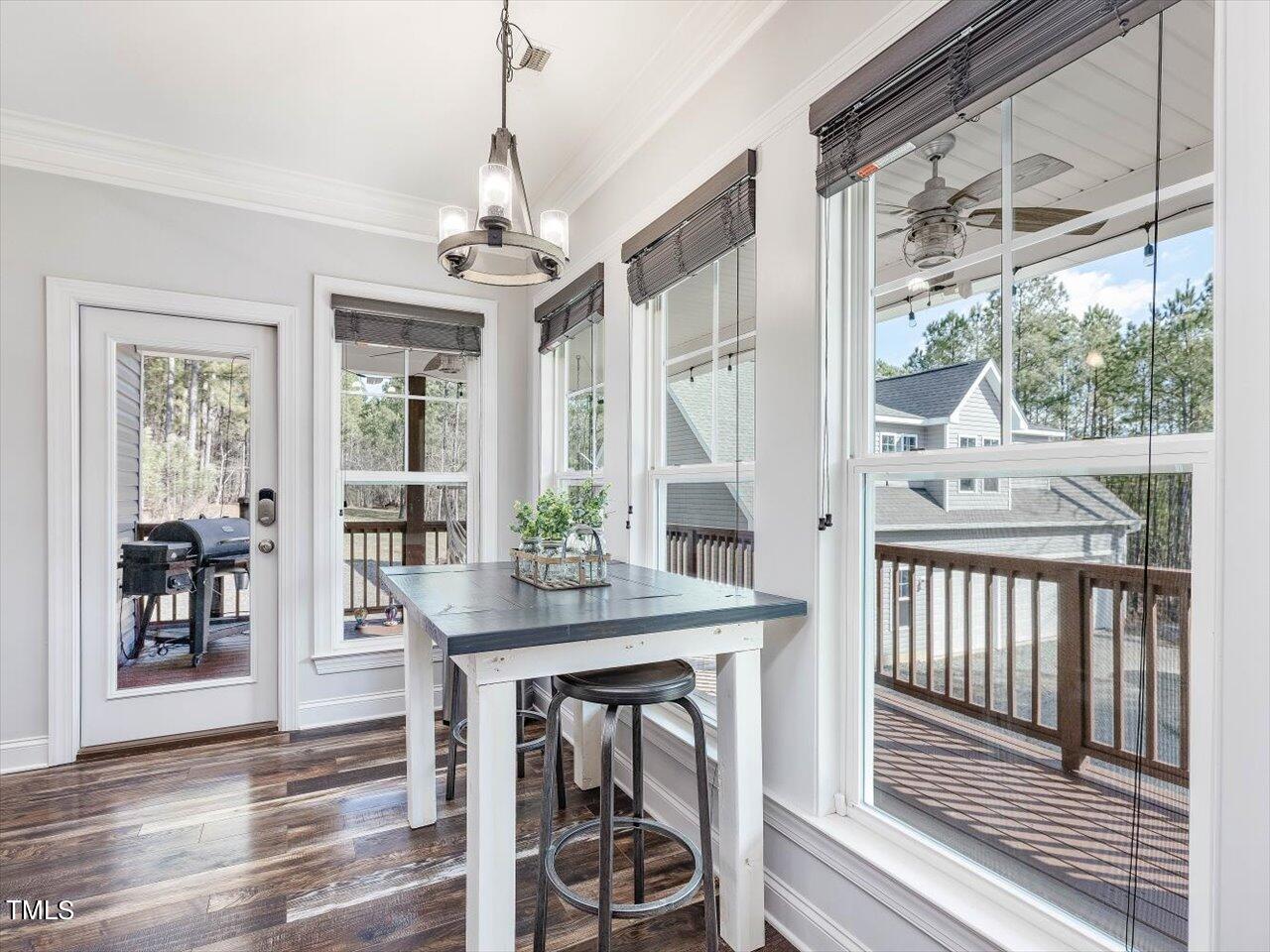 406 Gum Springs Church Road Moncure, NC 27559 - Photo 21 of 100 a view of a dining room with furniture window and wooden floor
