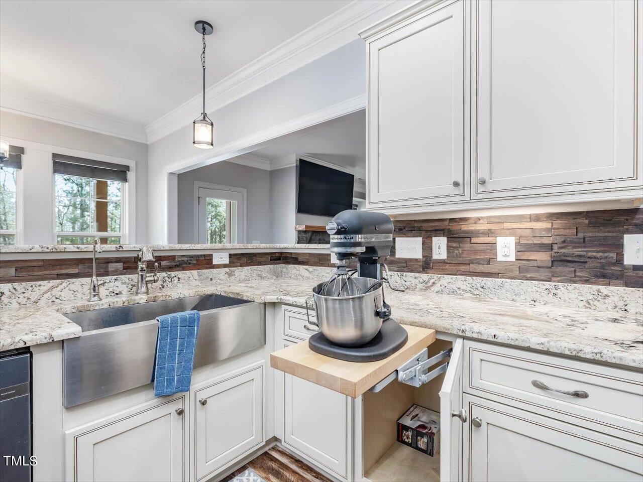 406 Gum Springs Church Road Moncure, NC 27559 - Photo 30 of 100 a kitchen with a stove and a white cabinets