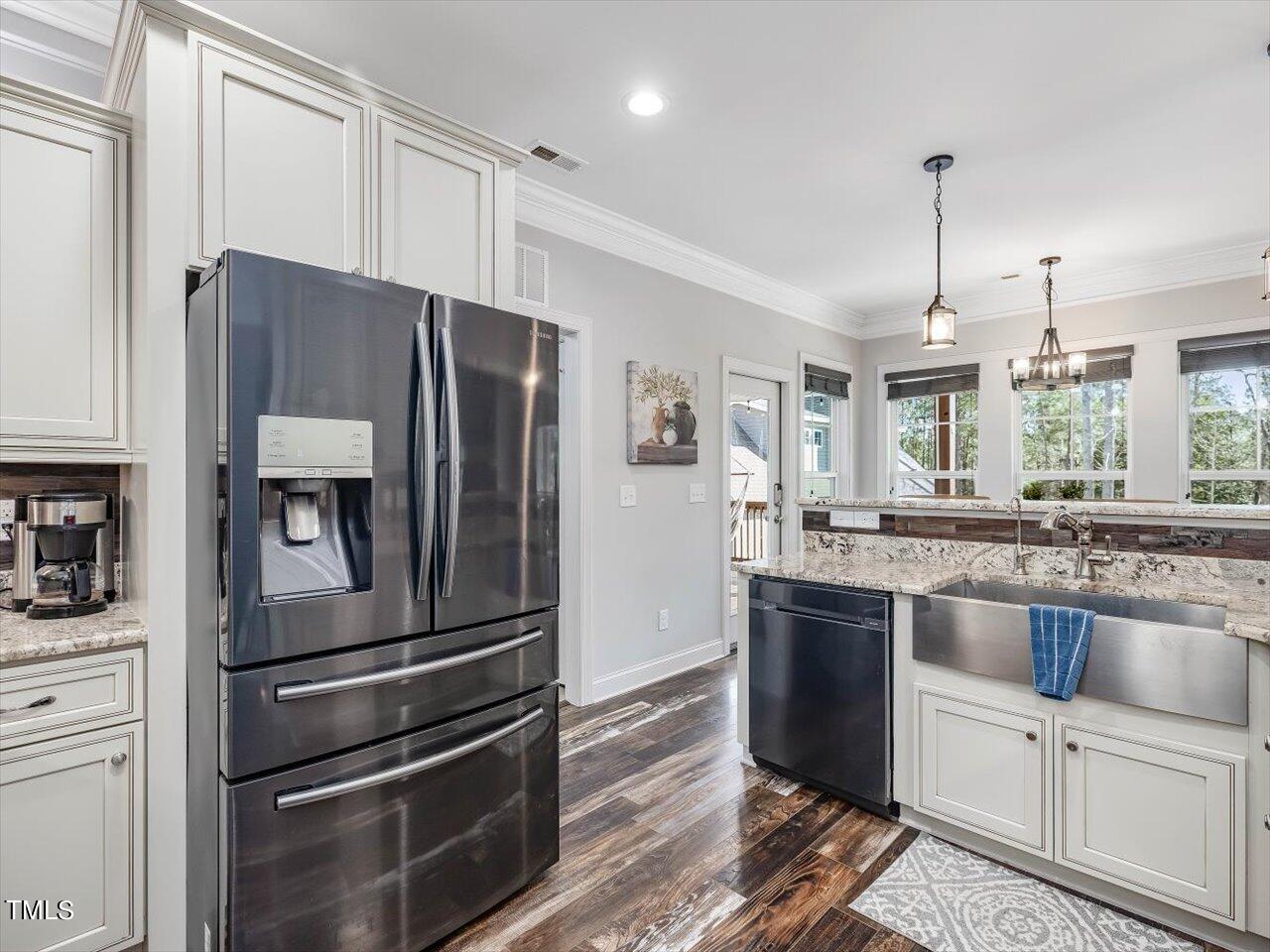 406 Gum Springs Church Road Moncure, NC 27559 - Photo 33 of 100 a kitchen with stainless steel appliances granite countertop a refrigerator and a stove