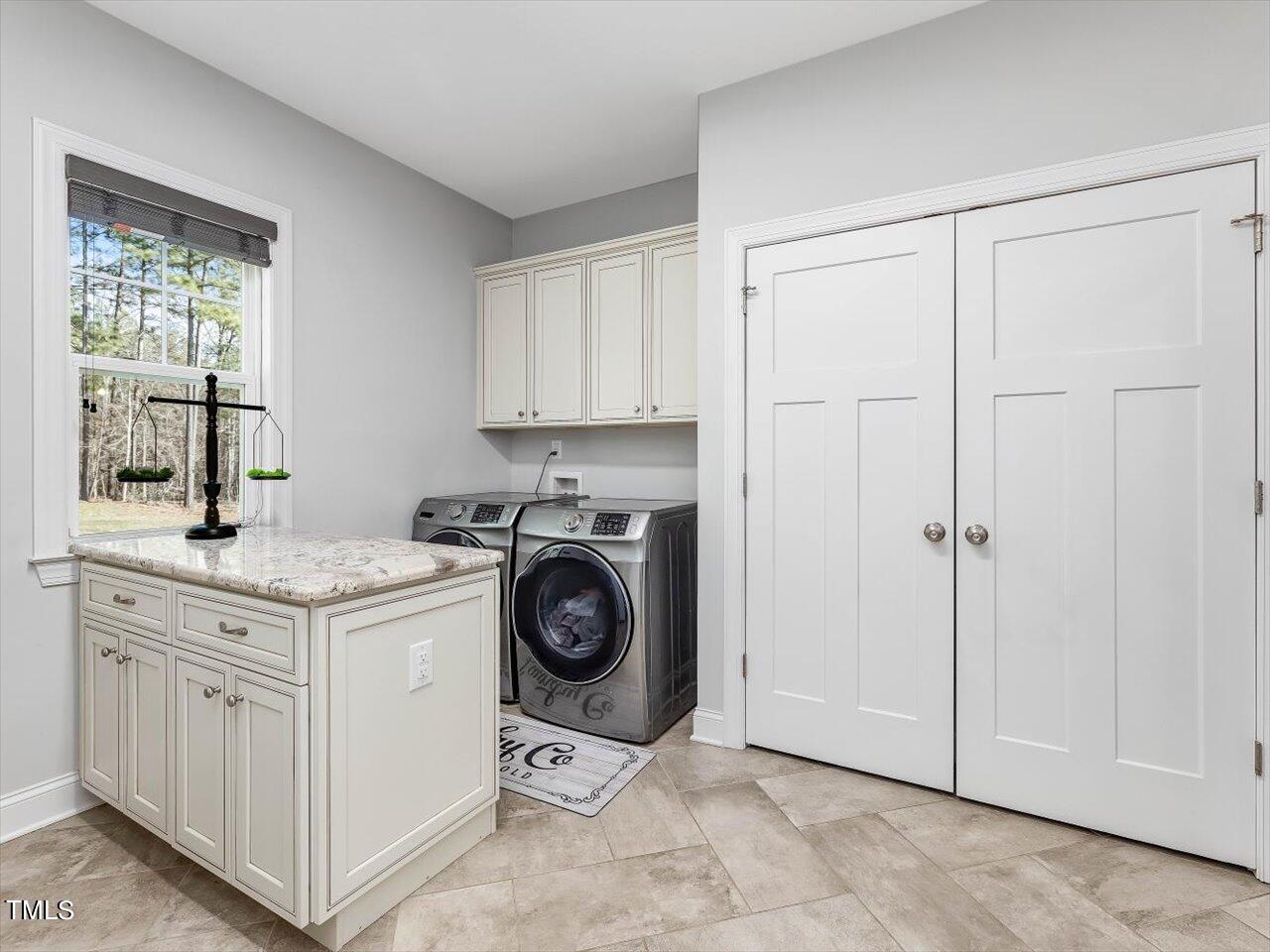 406 Gum Springs Church Road Moncure, NC 27559 - Photo 36 of 100 a view of a storage and utility room with washer and dryer