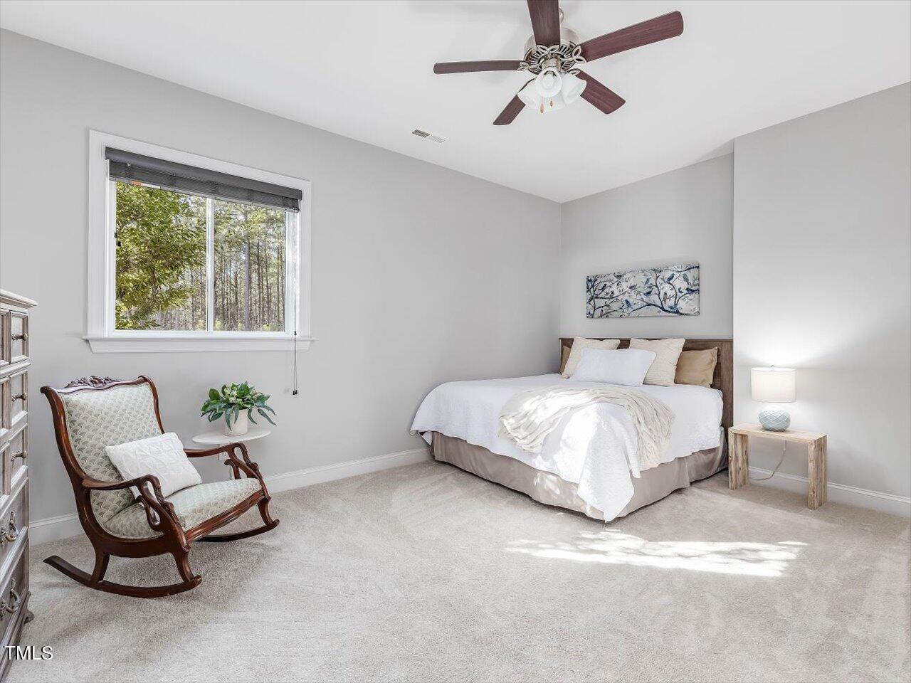 406 Gum Springs Church Road Moncure, NC 27559 - Photo 53 of 100 a bedroom with a bed chair and window