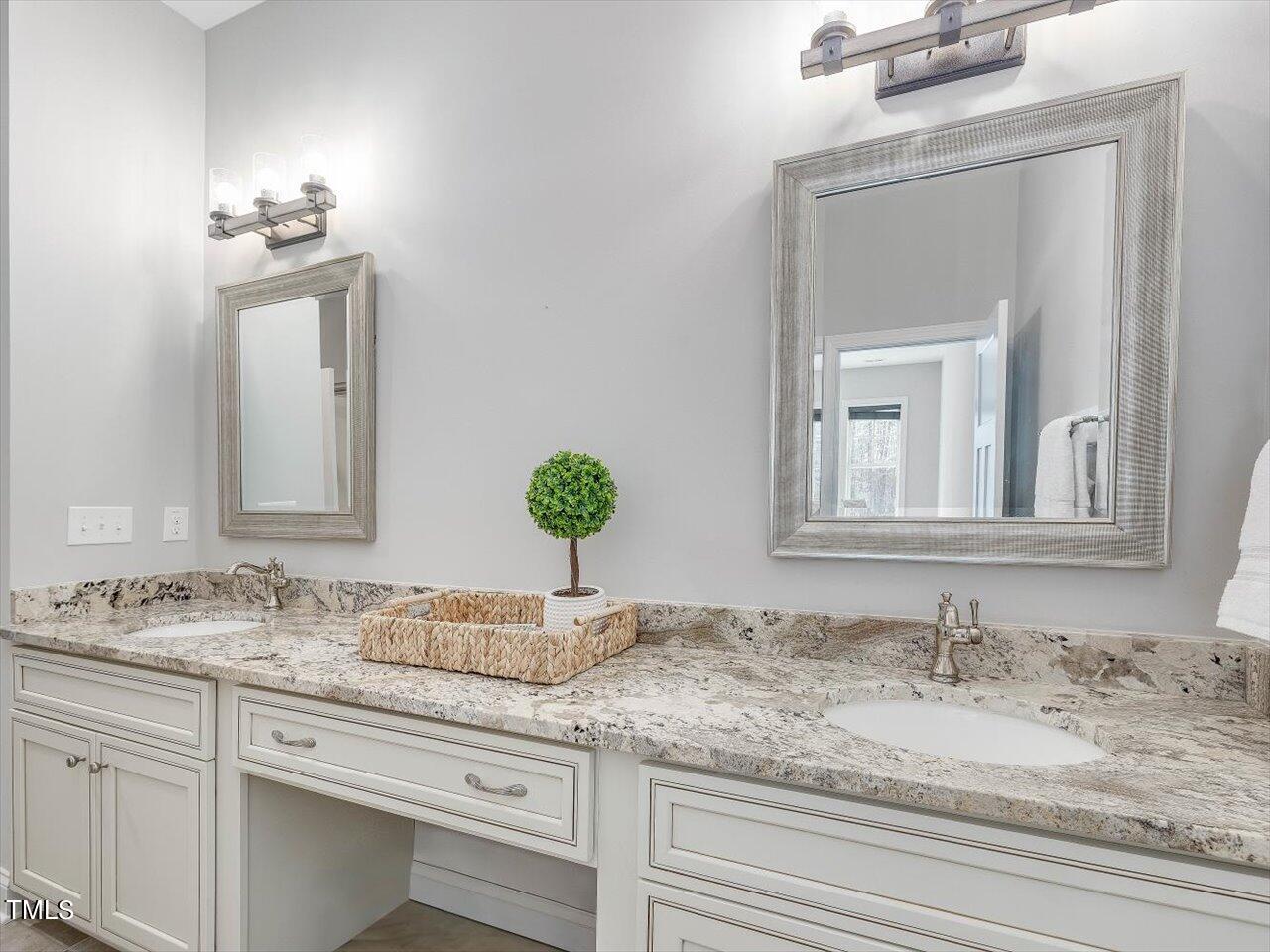 406 Gum Springs Church Road Moncure, NC 27559 - Photo 56 of 100 a bathroom with a granite countertop sink and a mirror