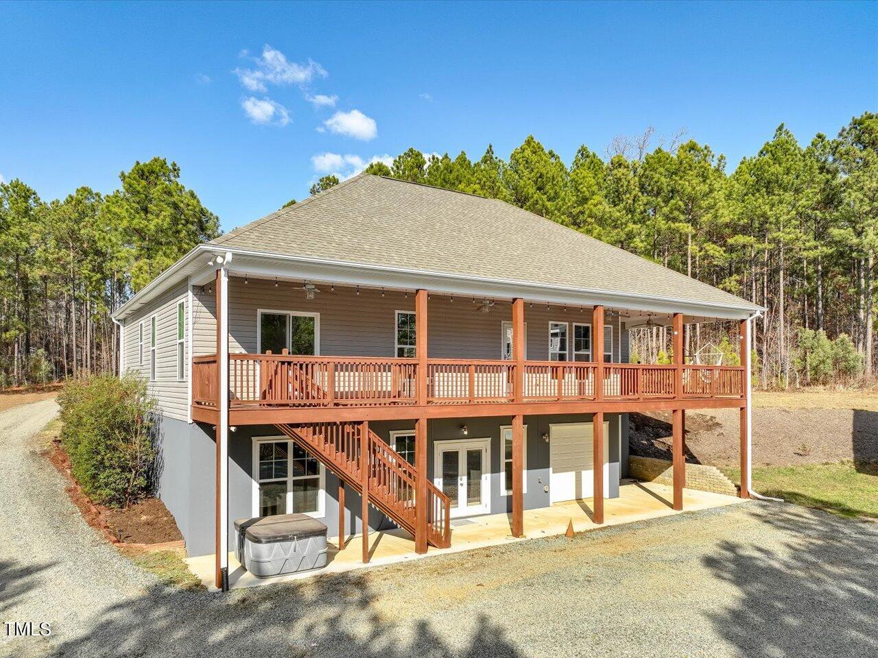 406 Gum Springs Church Road Moncure, NC 27559 - Photo 6 of 100 a view of a house with a backyard