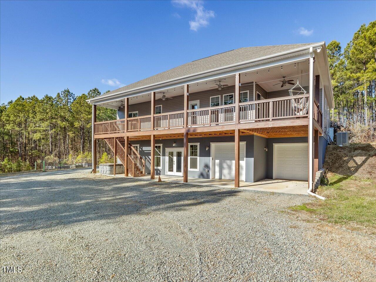 406 Gum Springs Church Road Moncure, NC 27559 - Photo 62 of 100 a front view of a house with a garden