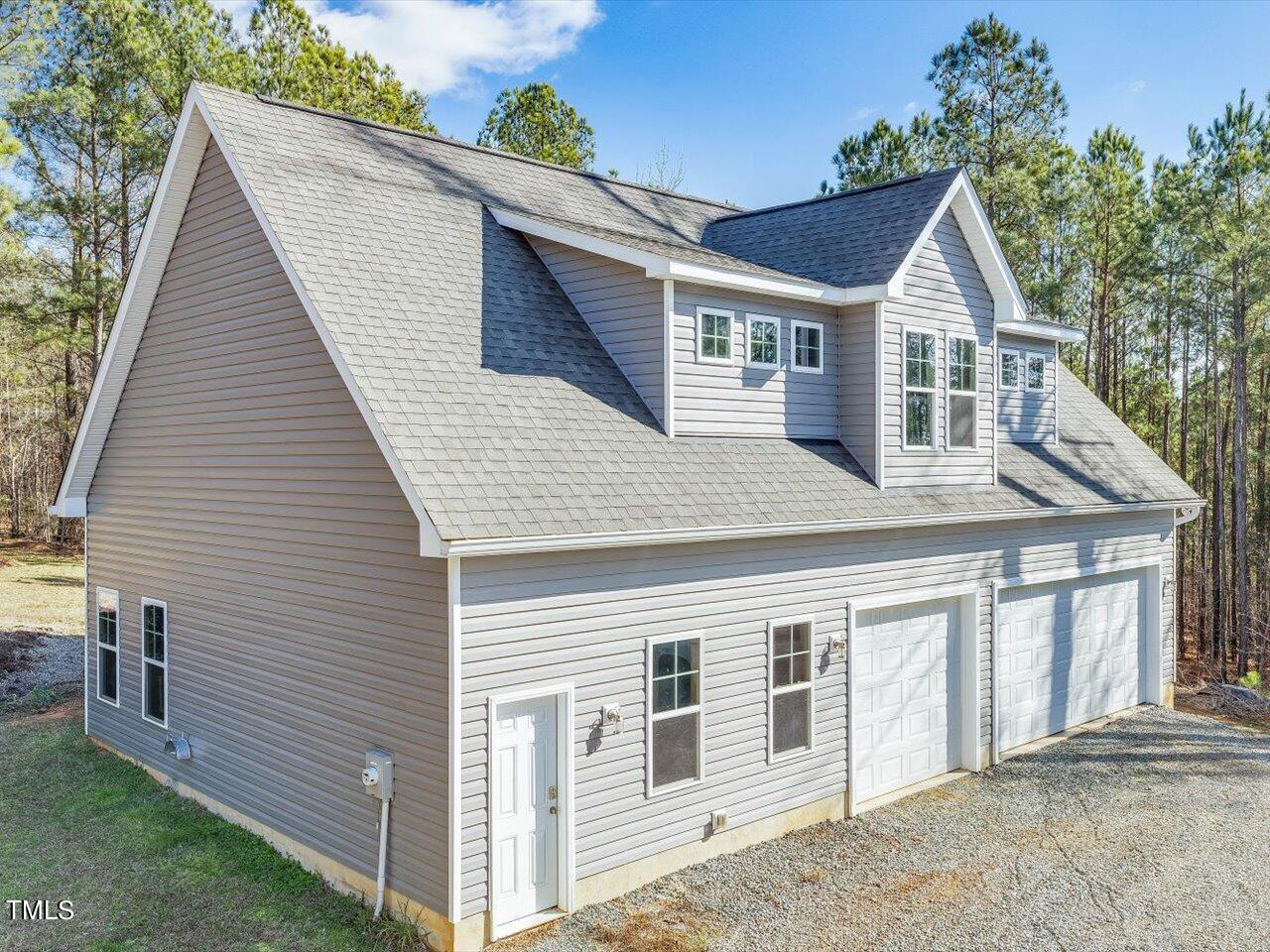 406 Gum Springs Church Road Moncure, NC 27559 - Photo 7 of 100 a front view of a house with a yard