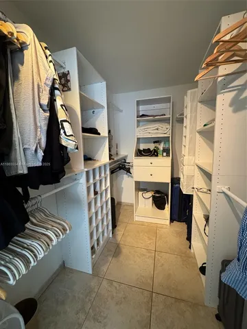 a bed room with a bed and a walk in closet
