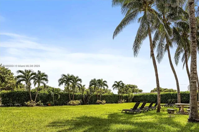 a view of swimming pool with a yard