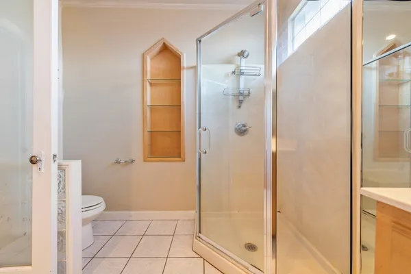 a bathroom with a shower and a toilet