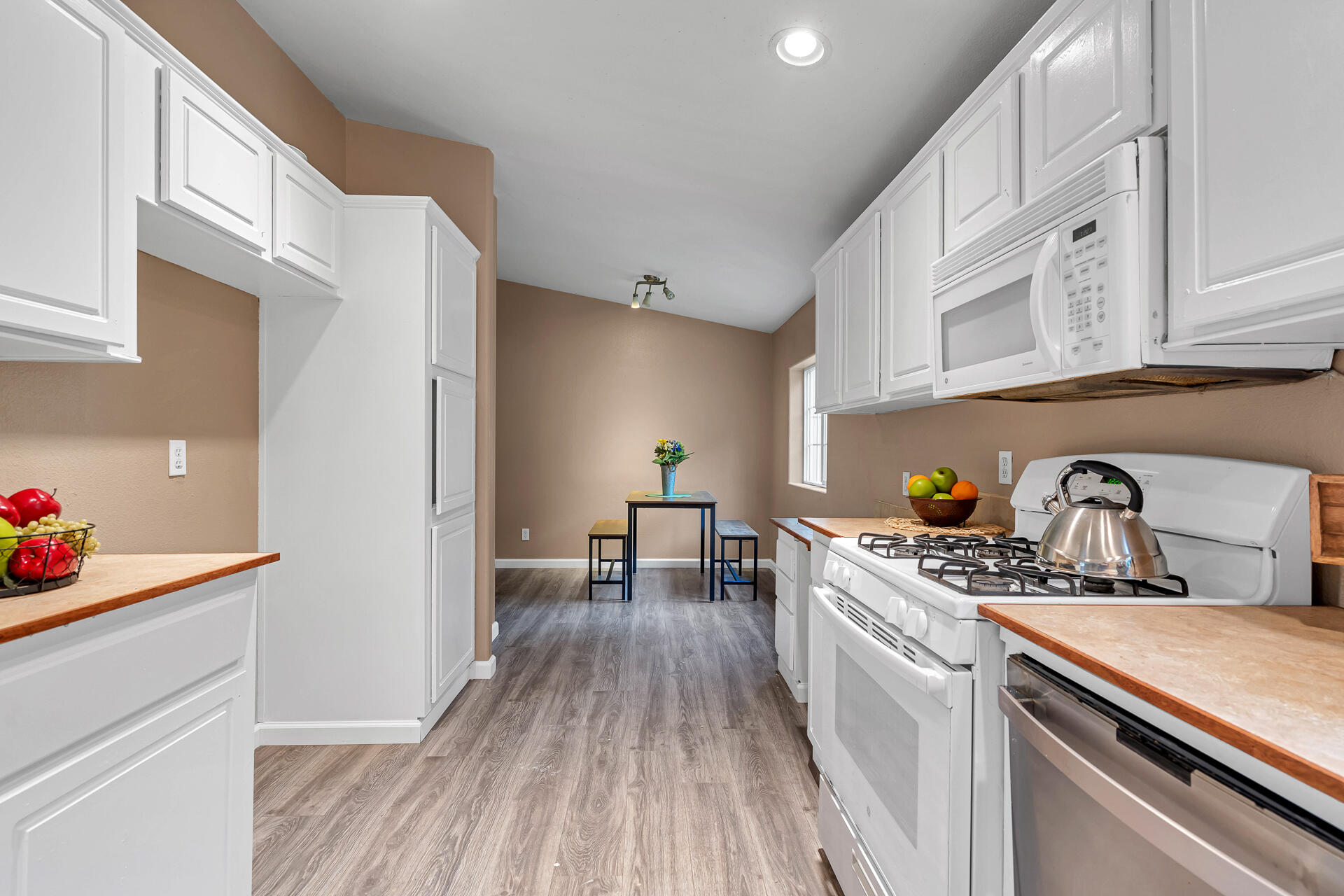 22150 Ravine Court Redding, CA 96003 - Photo 16 of 37 a kitchen with stainless steel appliances granite countertop a sink stove and cabinets