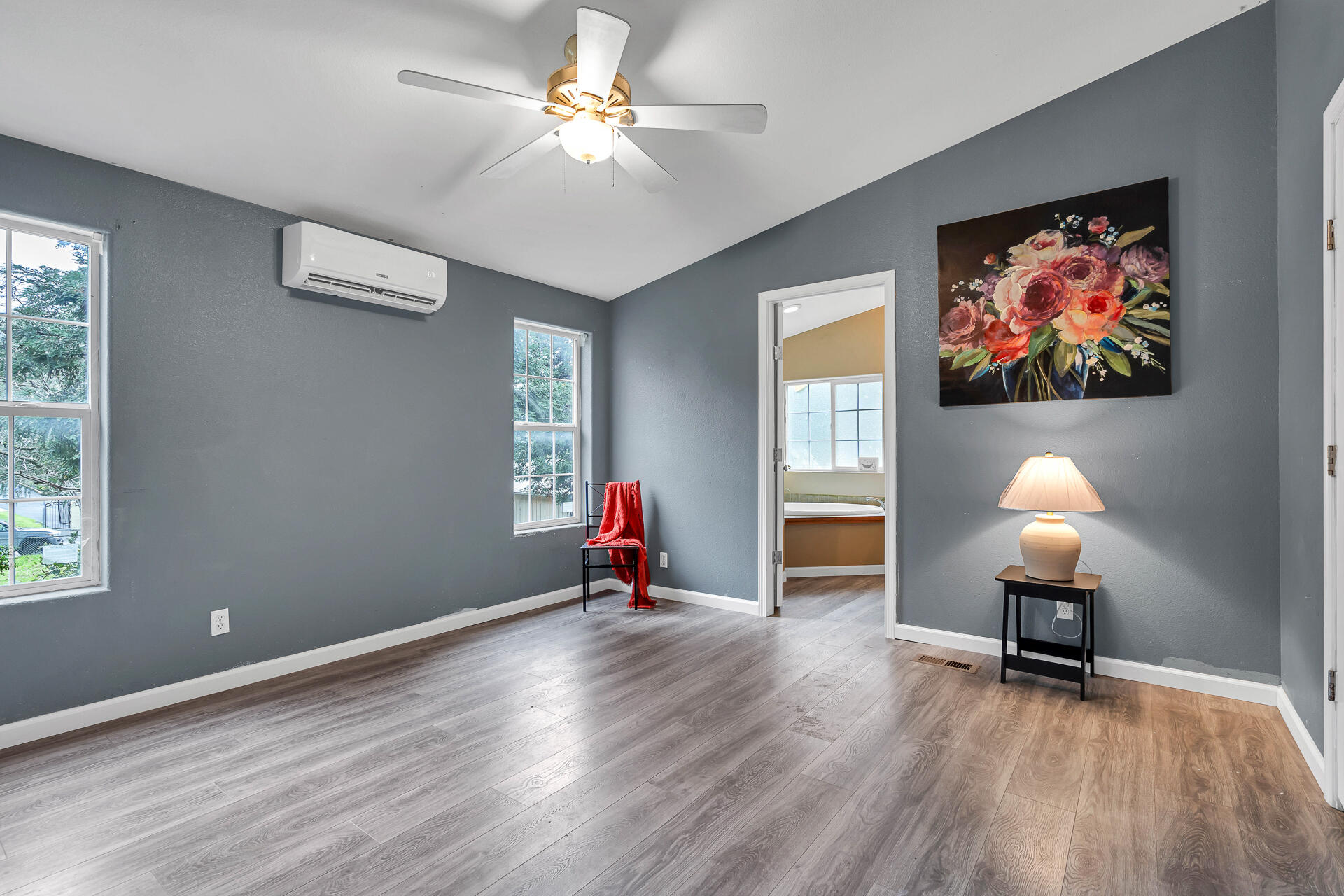 22150 Ravine Court Redding, CA 96003 - Photo 18 of 37 a view of room with wooden floor fan and window