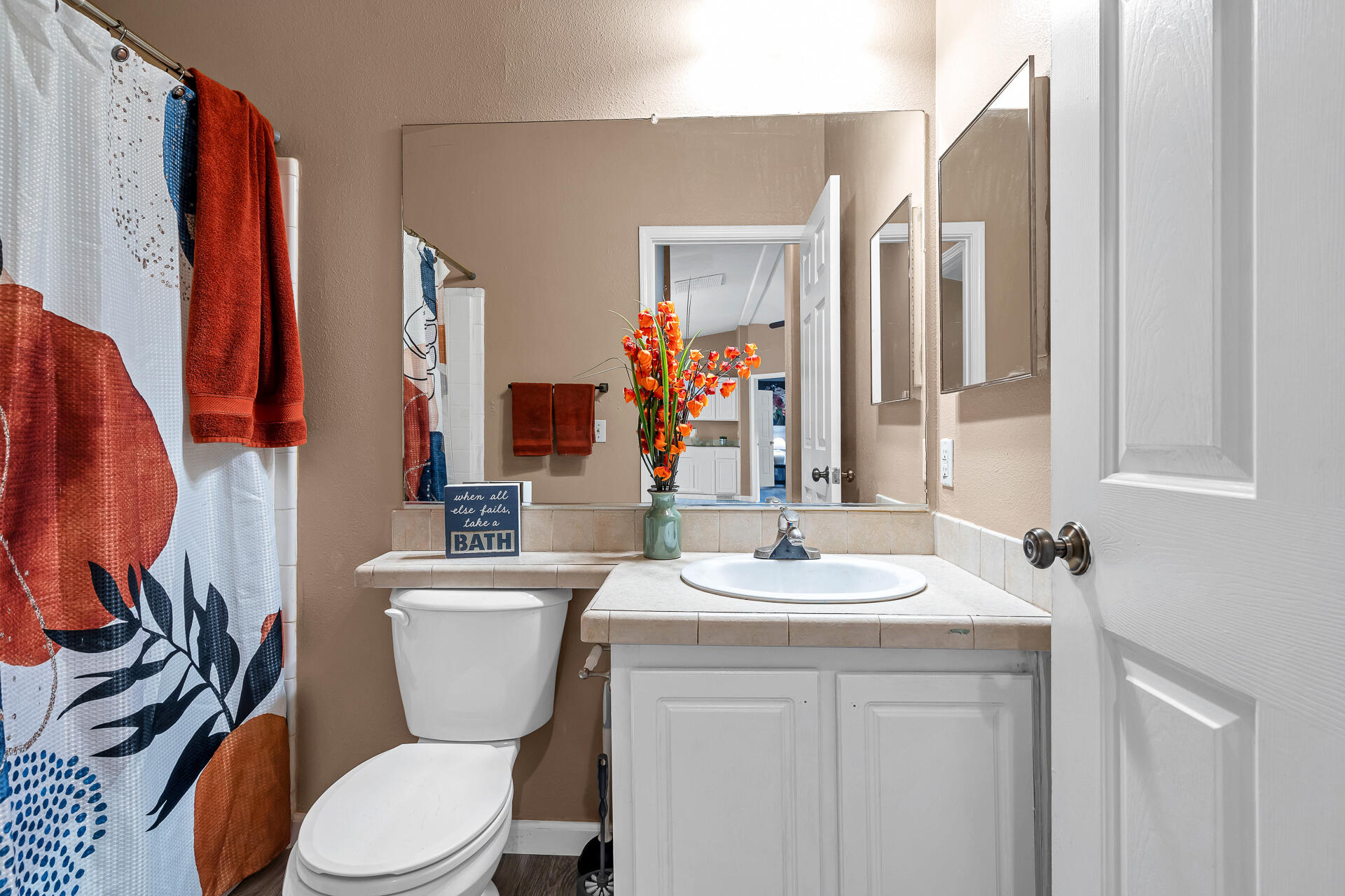 22150 Ravine Court Redding, CA 96003 - Photo 26 of 37 a bathroom with a toilet sink and mirror