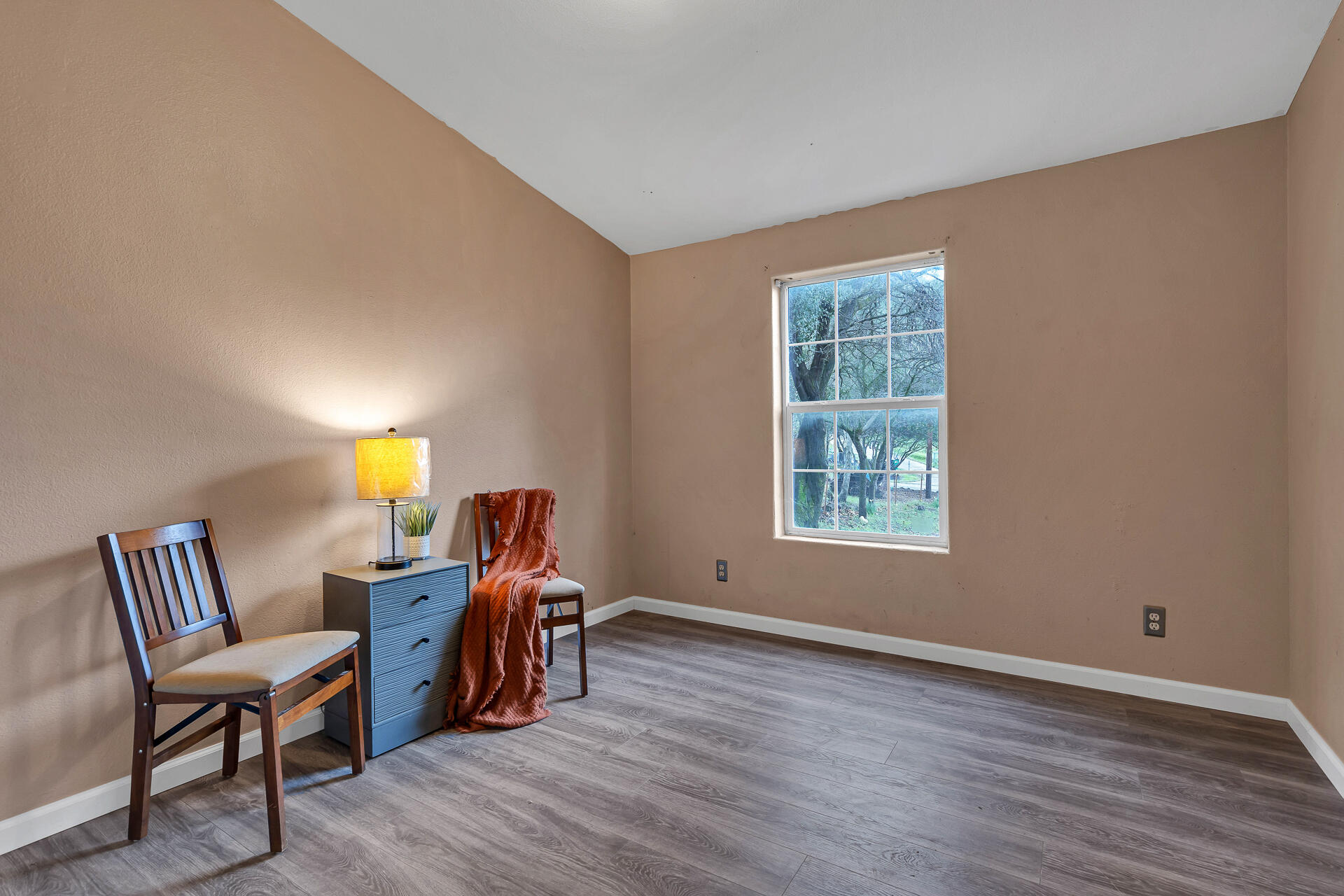 22150 Ravine Court Redding, CA 96003 - Photo 27 of 37 a view of a workspace with furniture and a window